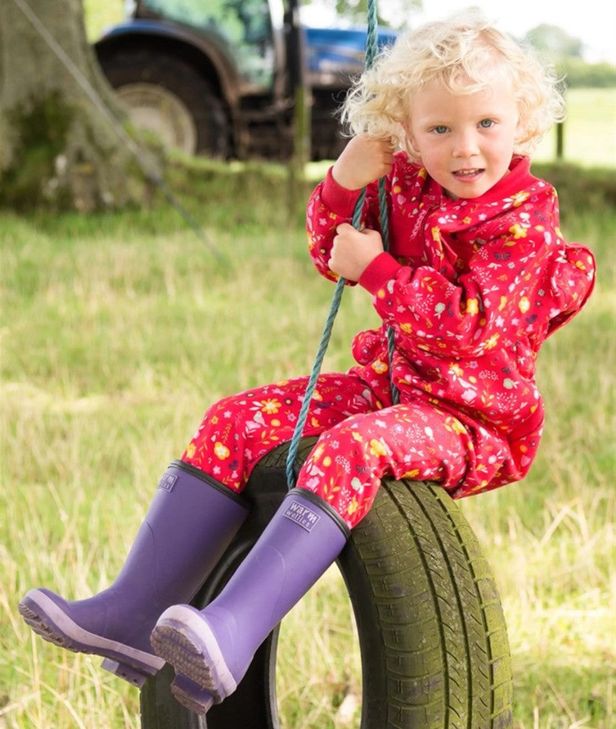 Child on tyre swing wearing Warm Wellies